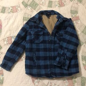 Flannel, sherpa lined, heavy button up shirt.